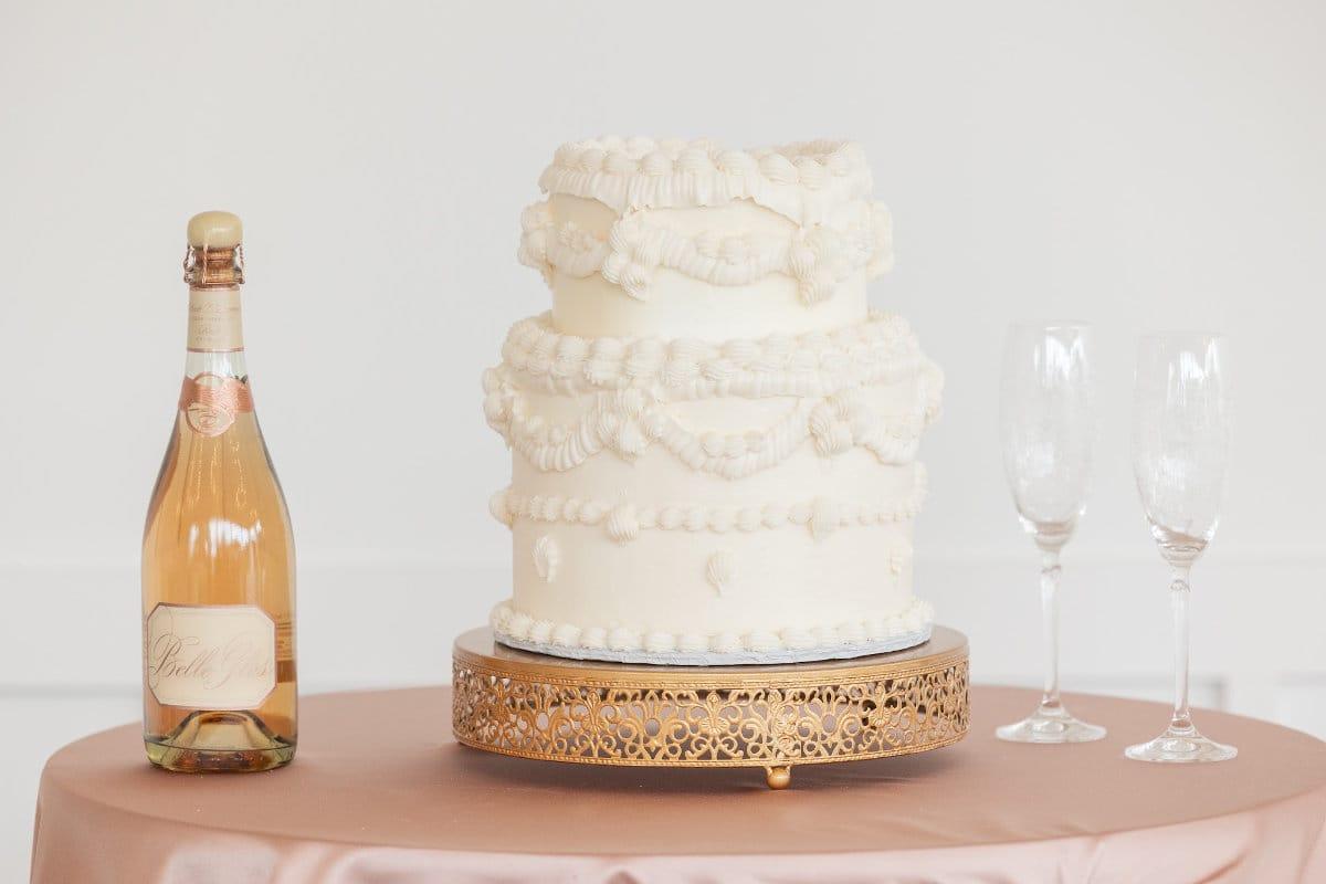 White wedding cake with glasses