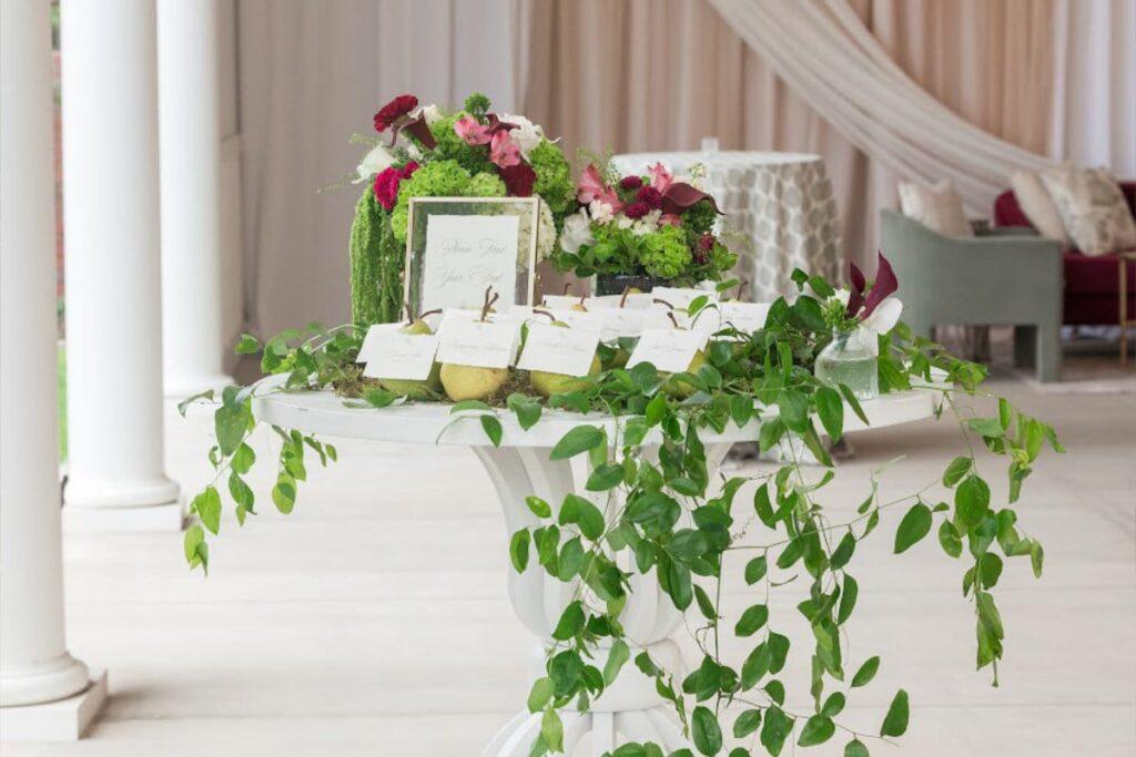 Reception table with greenery and flowers